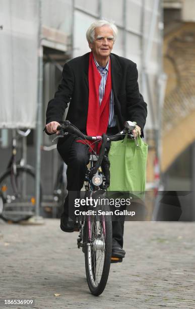 Hans-Christian Stroebele, member of the German Greens Party and the Bundestag, arrives on a bicycle to present a letter from Edward Snowden, former...