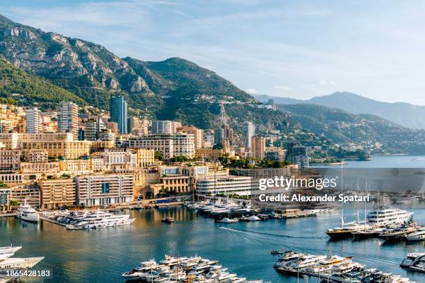 monte carlo skyline surrounded by sea and mountains, monaco - montecarlo fotografías e imágenes de stock