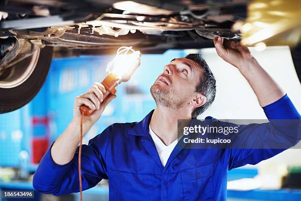 doing a thorough inspection for flaws - car inspection stock pictures, royalty-free photos & images