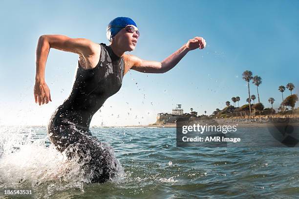 demonstrating endurance - triathlon stock pictures, royalty-free photos & images