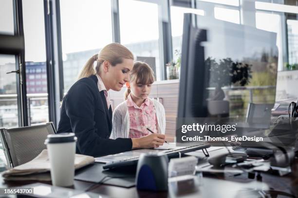 modern working woman with child - working parent stock pictures, royalty-free photos & images