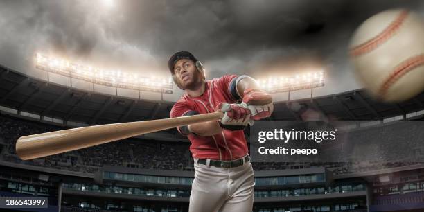 baseball player about to hit baseball - baseball batting stock pictures, royalty-free photos & images