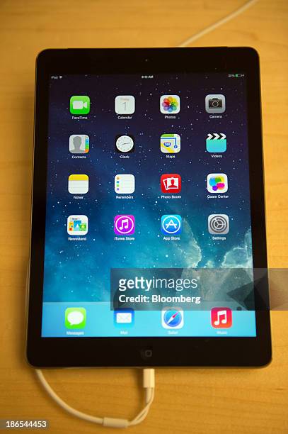New Apple Inc. IPad Air sits on display during the first day of sales at the 5th Avenue Apple store in New York, U.S., on Friday, Nov. 1, 2013. Apple...