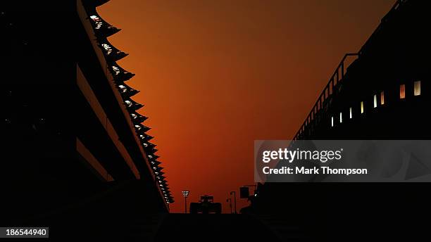 Sebastian Vettel of Germany and Infiniti Red Bull Racing exits the pit lane as he drives during practice for the Abu Dhabi Formula One Grand Prix at...