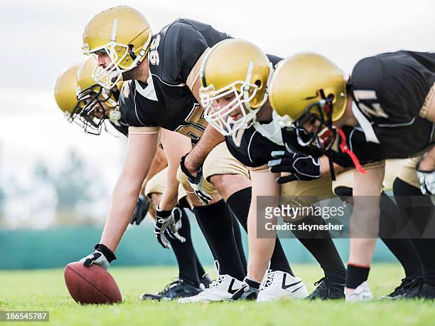 american football players lining up. - american football lineman stock pictures, royalty-free photos & images