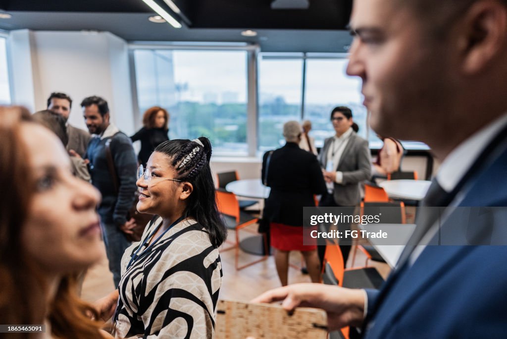 Colleagues talking during coffee break