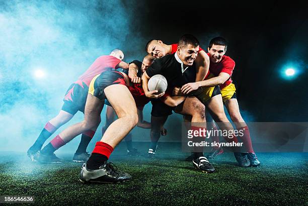 rugby action at night. - touchdown stock pictures, royalty-free photos & images
