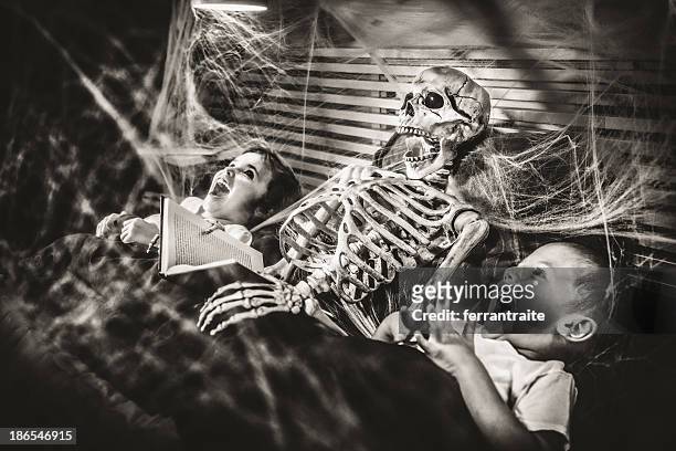 halloween bedtime stories - halloween skeleton stock pictures, royalty-free photos & images