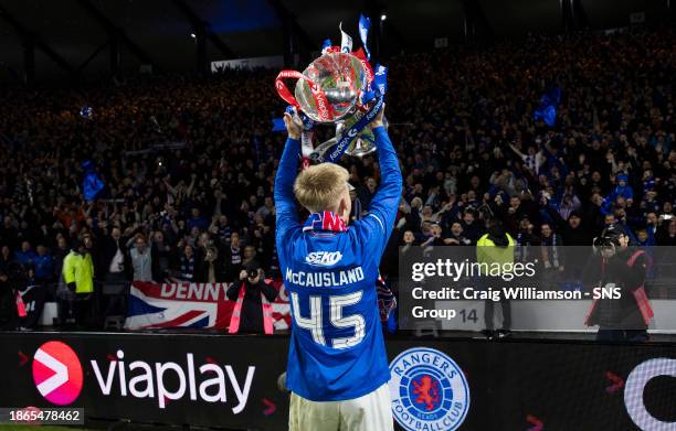 Rangers' Ross McCausland lifts the Viaplay Cup trophy after the Viaplay Cup Final match between Rangers and Aberdeen at Hampden Park, on December 17...