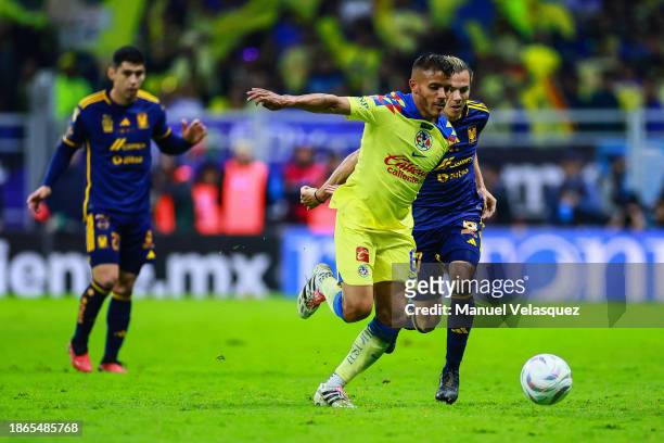 Francisco Córdova of Tigres battles for the ball against Jonathan Dos Santos of America during the final second leg match between America and Tigres...
