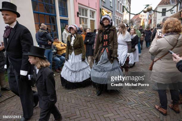 People dressed as characters from Charles Dickens' books participate in the Dickens Festival on December 16, 2023 in Deventer, Netherlands. Some 900...