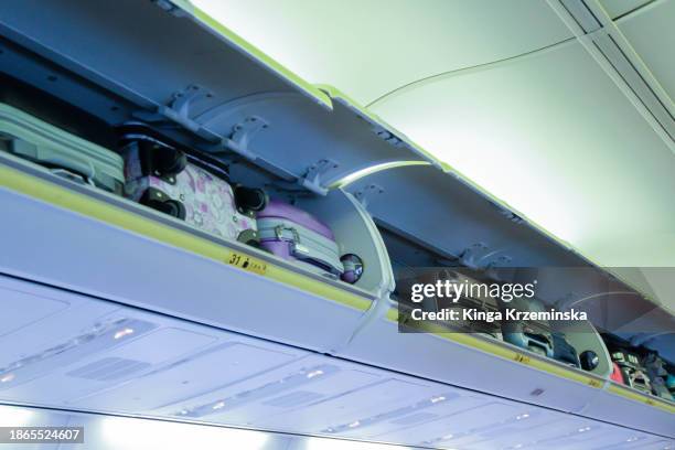 suitcases - gepäckablage stock-fotos und bilder