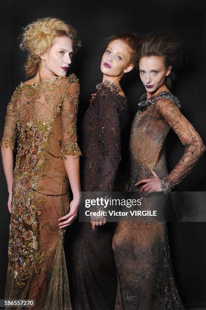 Cintia Dicker, Alicia Kuczman and Izabel Hickman pose during the Lino Villaventura show at the Sao Paulo Fashion Week Winter 2014 on October 31, 2013...