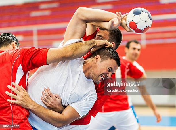 group of handball players in action. - handball stock pictures, royalty-free photos & images