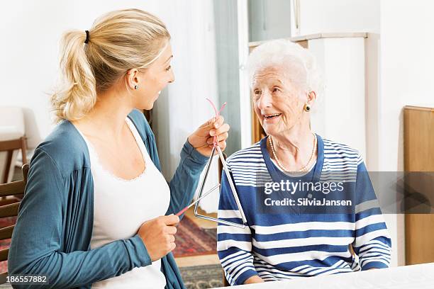 alzheimer therapy senior woman musical instrument - music therapy stock pictures, royalty-free photos & images