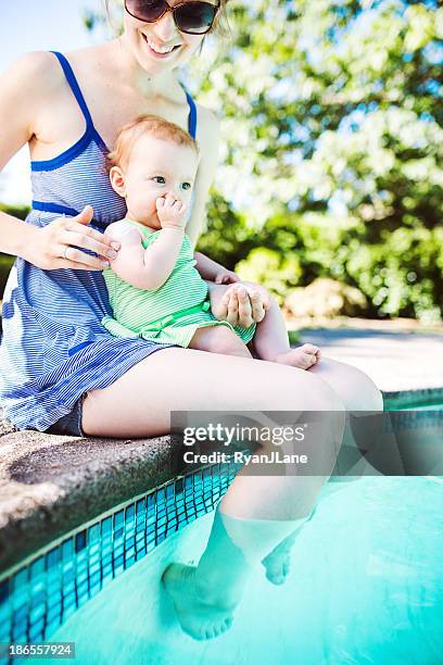 baby and mother applying sunscreen - baby suncream stock pictures, royalty-free photos & images