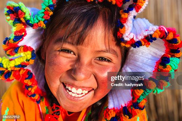 little girl on uros floating island, lake tititcaca, peru - quechua stock pictures, royalty-free photos & images