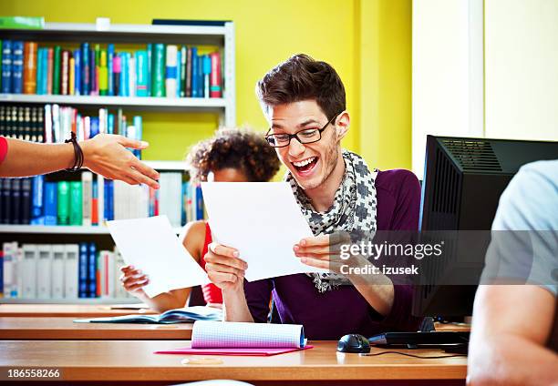 happy student - receiving paper stock pictures, royalty-free photos & images