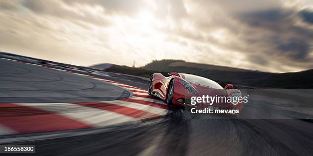 red sports car on racetrack - supercar stockfoto's en -beelden