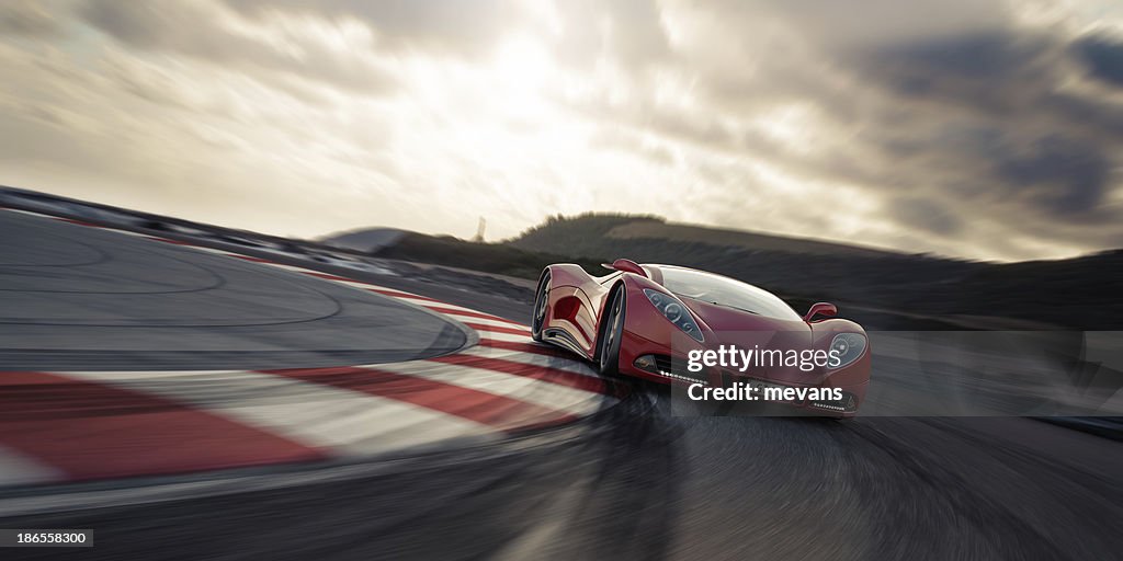 Red sports car on racetrack