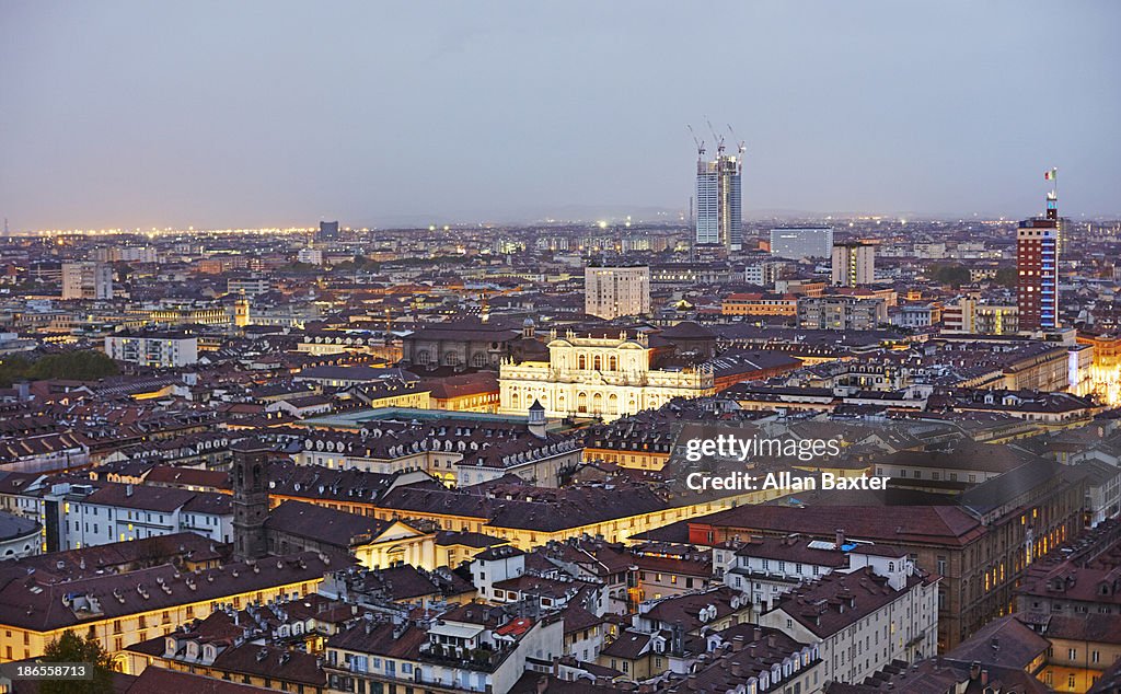 Skyline of Turin illuminated at dusk