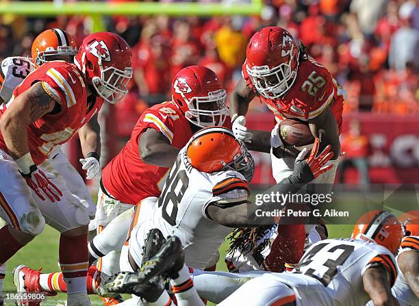 Running back Jamaal Charles of the Kansas City Chiefs rushes against pressure from defensive linemen Phil Taylor of the Cleveland Browns during the...