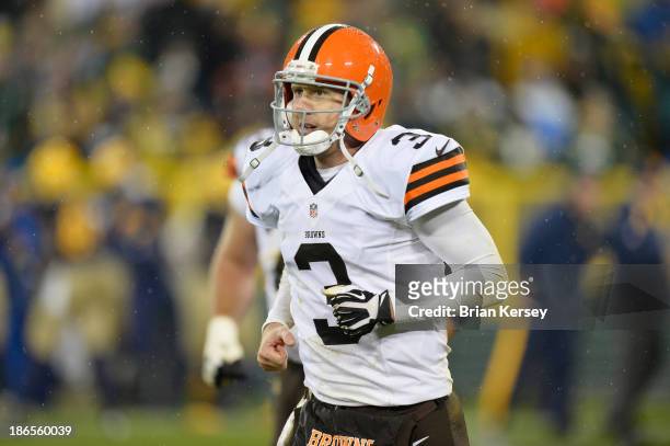 Quarterback Brandon Weeden of the Cleveland Browns runs off the field during the fourth quarter against the Green Bay Packers at Lambeau Field on...