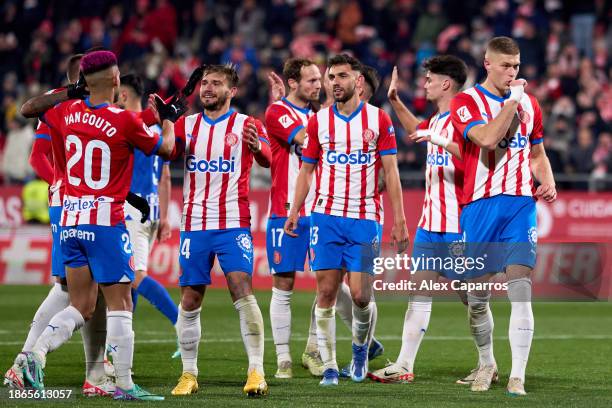 Artem Dovbyk of Girona FC celebrates with teammates after scoring their team's third goal with a penalty kick during the LaLiga EA Sports match...