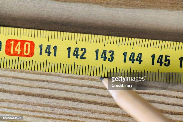 yellow tape measure meter - centimeter stock pictures, royalty-free photos & images