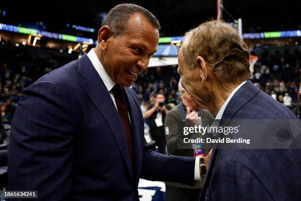 Part owners Alex Rodriguez and Glen Taylor of the Minnesota Timberwolves celebrate after the game against the Boston Celtics at Target Center on...