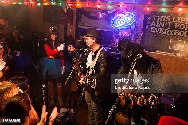 Rachel Reinert, Tom Gossin, Mike Gossin, perform at the T.J. Martell Foundation's Battle for the Bones for the Linds Sarcoma Fund at Losers Bar &...