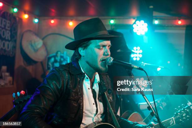 Tom Gossin performs at the T.J. Martell Foundation's Battle for the Bones for the Linds Sarcoma Fund at Losers Bar & Grill on October 31, 2013 in...