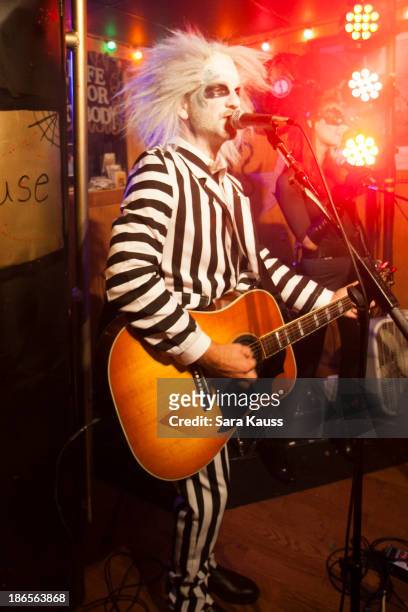 Craig Campbell performs at the T.J. Martell Foundation's Battle for the Bones for the Linds Sarcoma Fund at Losers Bar & Grill on October 31, 2013 in...