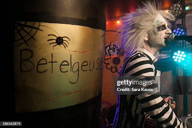 Craig Campbell performs at the T.J. Martell Foundation's Battle for the Bones for the Linds Sarcoma Fund at Losers Bar & Grill on October 31, 2013 in...