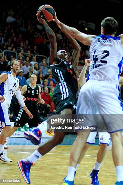 Jamar Smith, #31 of Brose Baskets Bamberg competes with Stanko Barac, #42 of Anadolu Efes Istanbul during the 2013-2014 Turkish Airlines Euroleague...