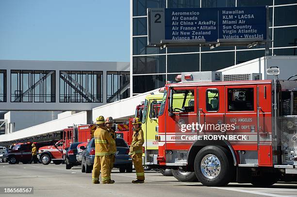 Emergency fire trucks at an airport, representing the emergency response.