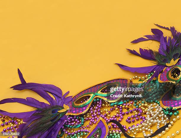 mardi gras in yellow - mardi gras mask stock pictures, royalty-free photos & images