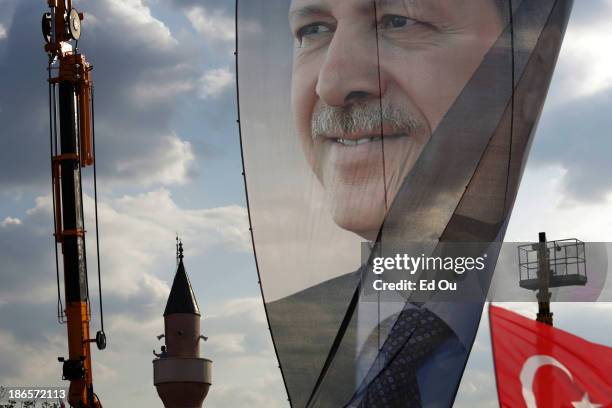 Large banner of Turkish Prime Minister Recep Tayyip Erdogan is seen in a pro-government rally in the Kazlçesme district of Istanbul, Turkey on June...