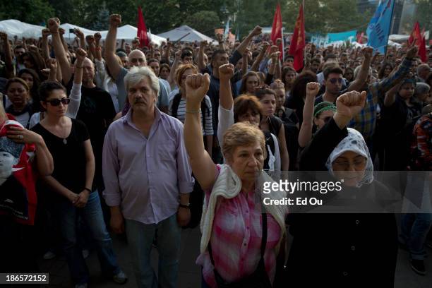 Protesters hold a moment of silence for demonstrators who were killed during the recent violence in Gezi Park in Istanbul, Turkey on June 14, 2013....