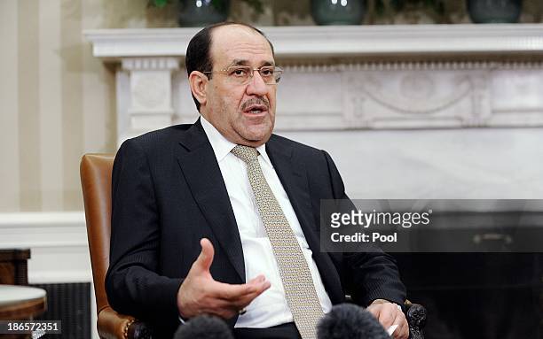 Iraqi Prime Minister Nouri Al-Maliki speaks during a meeting with U.S. President Barack Obama in the Oval Office at the White House November 1, 2013...