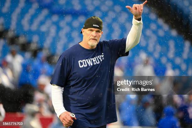 Defensive coordinator Dan Quinn of the Dallas Cowboys gestures to fans prior to the game prior to the game against the Buffalo Bills at Highmark...