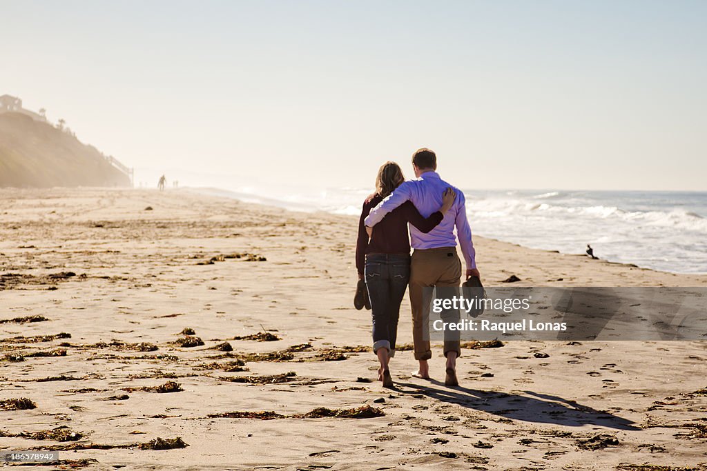 Young couple walking on the beach