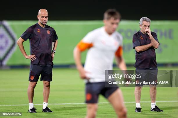 Pep Guardiola the head coach / manager of Manchester City and his assistant Juanma Lillo during the MD-1 training session prior to the FIFA Club...