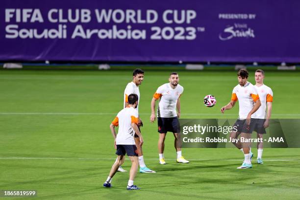 Ruben Dias and Bernardo Silva of Manchester City alongside teammates during the MD-1 training session prior to the FIFA Club World Cup Final match...