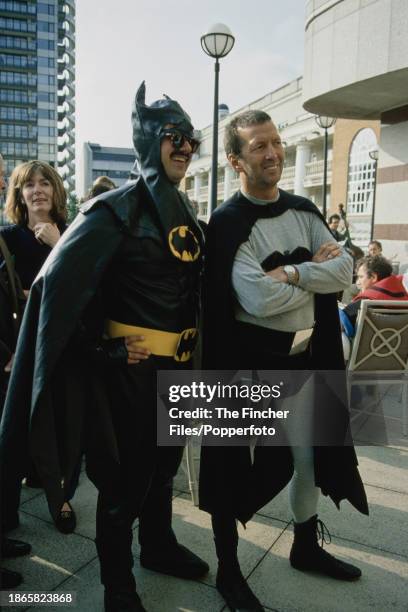 British singer and guitarist Eric Clapton dressed as Batman & Robin during a charity car rally in London, England circa 1995.