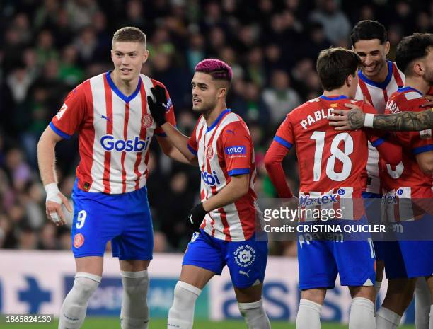 Girona's Ukrainian forward Artem Dovbyk celebrates with teammates after scoring his team's first goal during the Spanish league football match...
