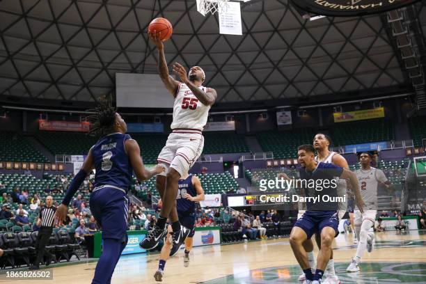 Shane Dezonie of the Temple Owls attempts to lay the ball in during the first half of the game against the Nevada Wolf Pack in the Diamond Head...