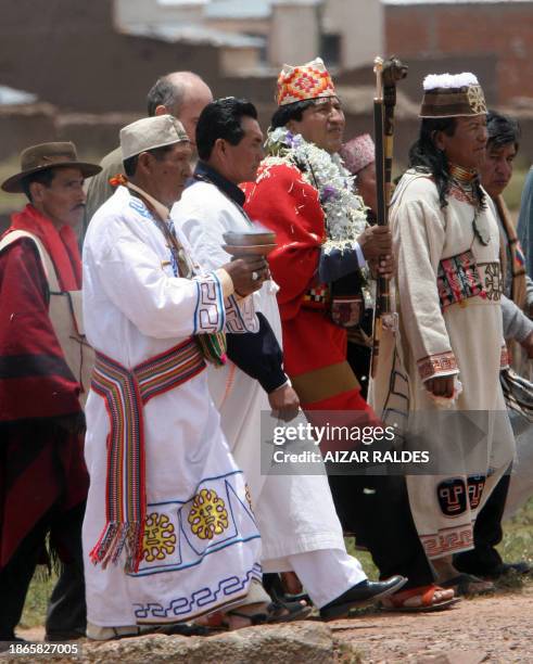 Bolivia's President-elect Evo Morales , dressed with traditional clothes, is flanked by Amautas -Aymara wise men- during an ancient ritual in the...