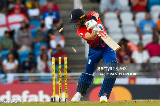 Chris Woakes of England bowled by Andre Russell of the West Indies during the 5th T20I between the West Indies and England at Brian Lara Cricket...
