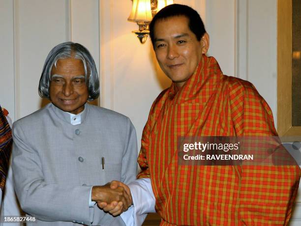 King of Bhutan Jigme Singye Wangchuck shakes hands with Indian President A.P.J. Abdul Kalam, during a meeting at the Presidential Palace in New...